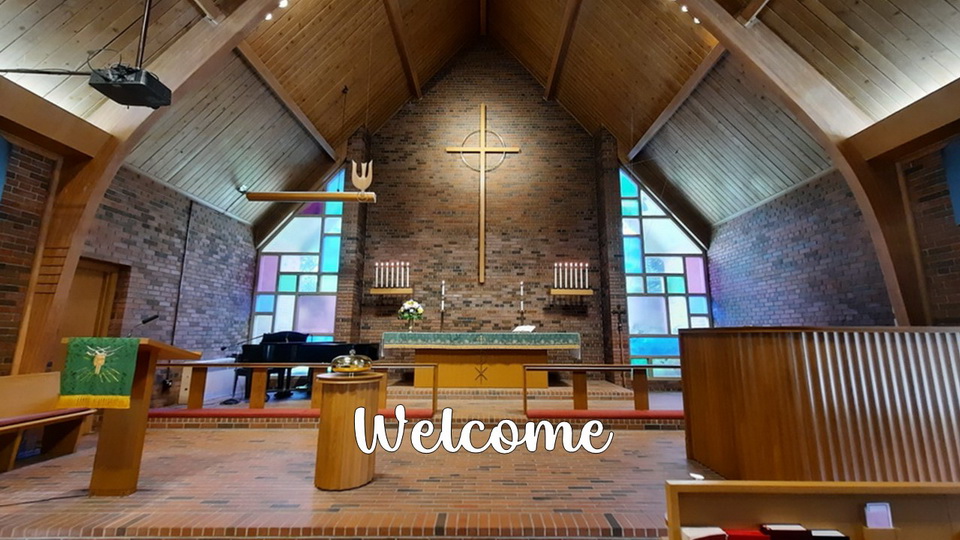 The sanctuary at St. Mark's featuring a central altar with coloured glass windows on either side. The word "Welcome" is on the picture.