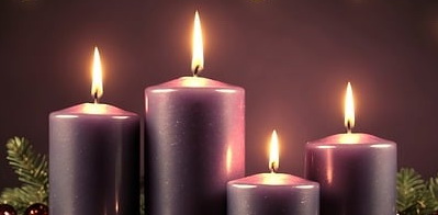 Four purple Advent candles, lit.